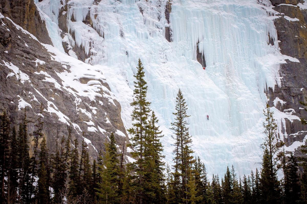 ice climber frozen waterfall